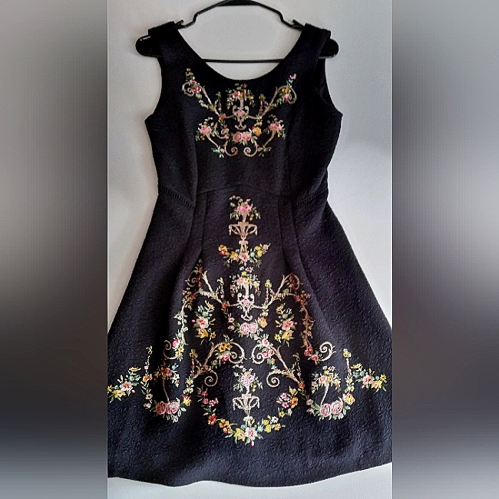 Beautiful black embossed fabric dress with ornate embroidery